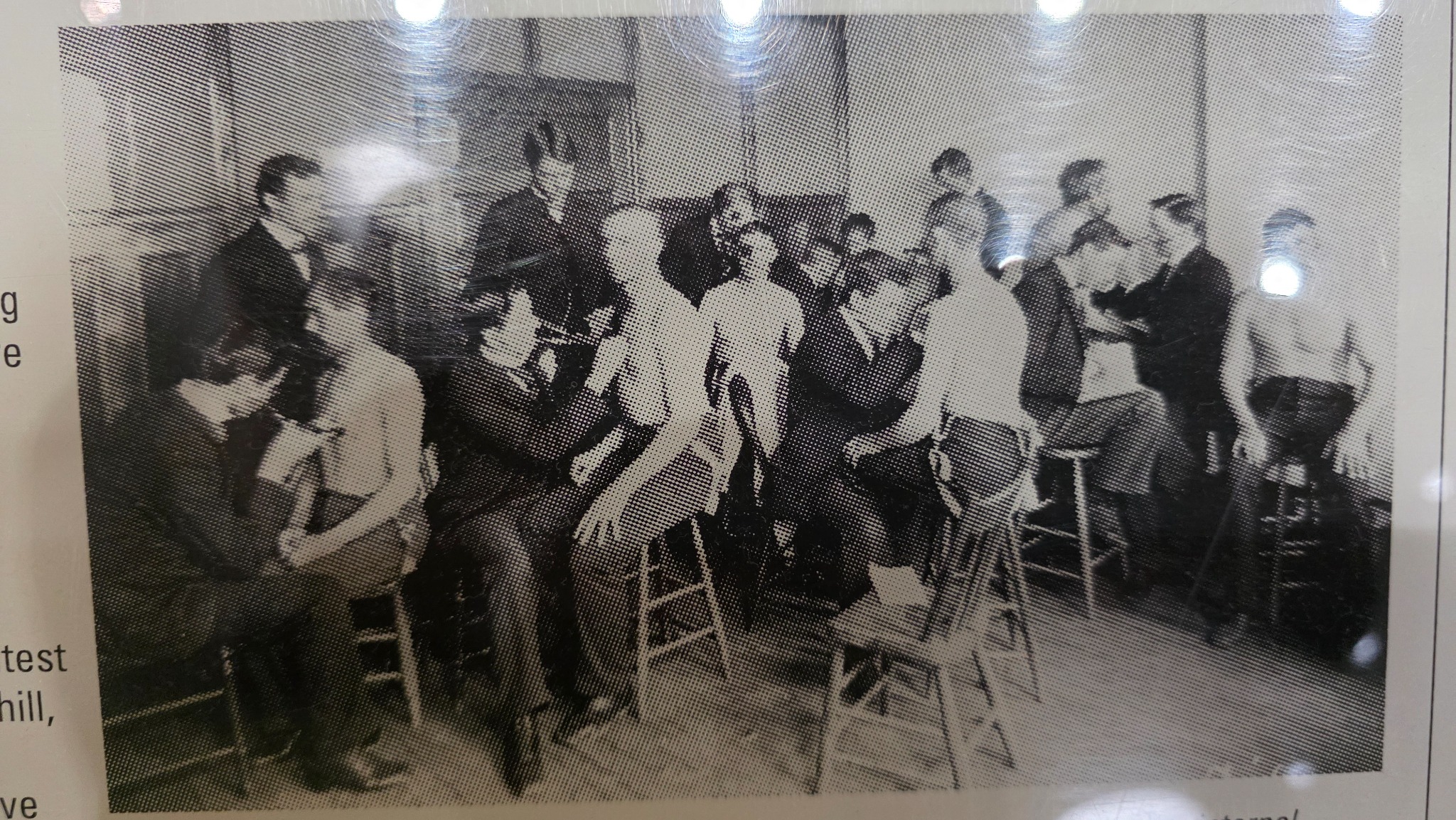 Historical classroom photograph on display