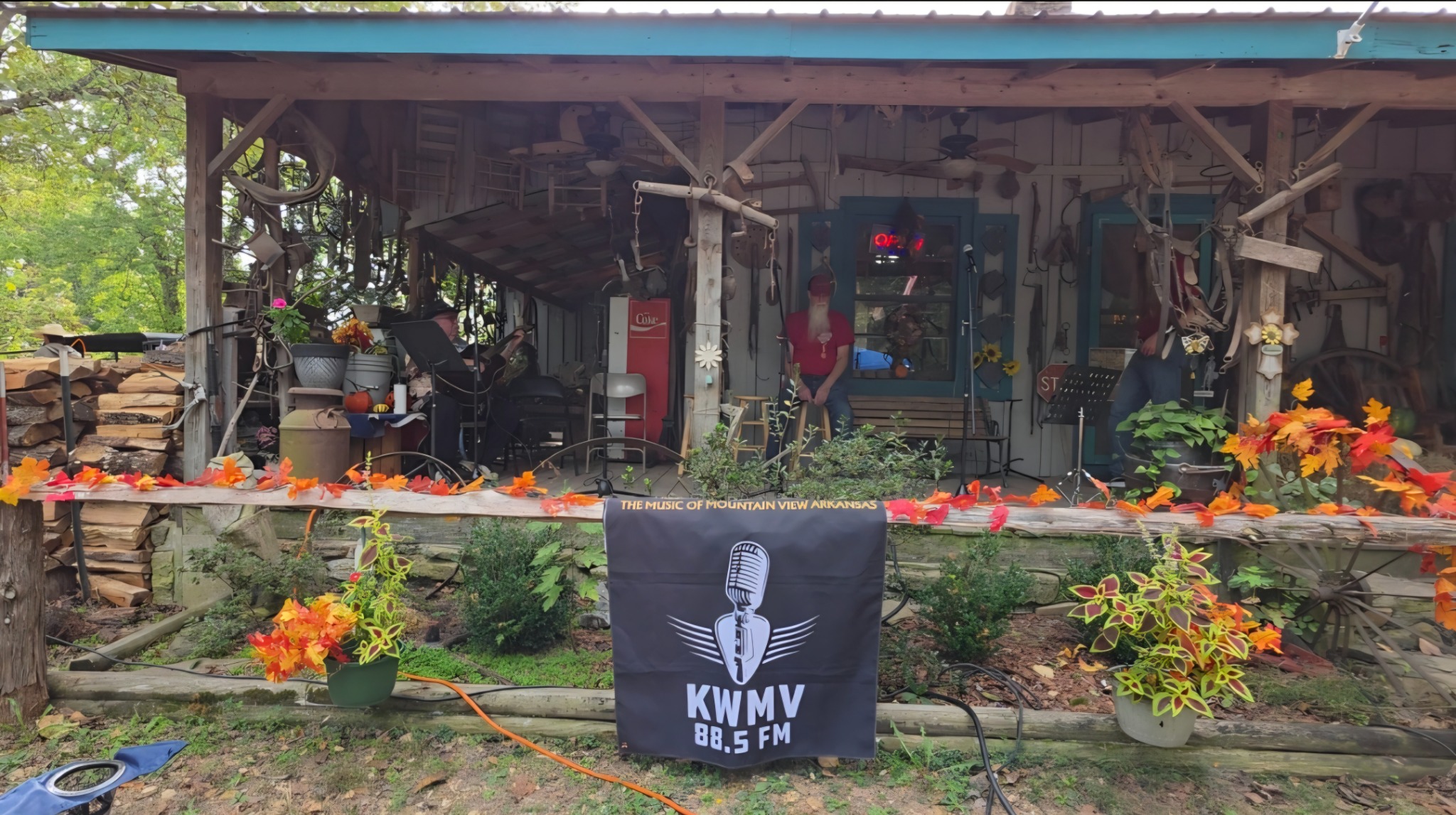 Autumn decorations and the KWMV 88.5 FM banner at the O.K. Trading Post Front Porch Jam