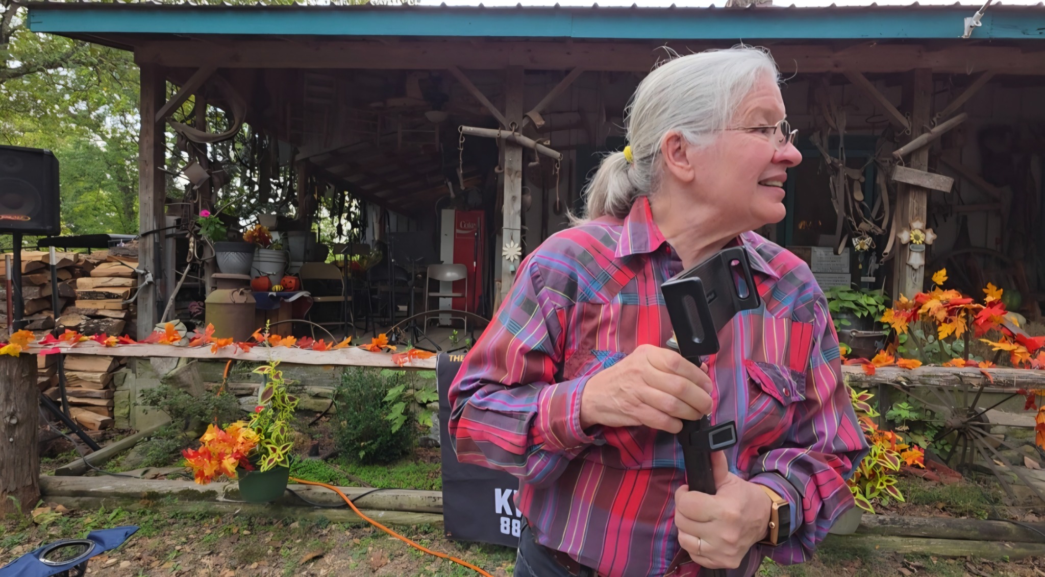 Becky Thomas Timberlane, Al’s wife and personal assistant, helping set up microphones and cameras.