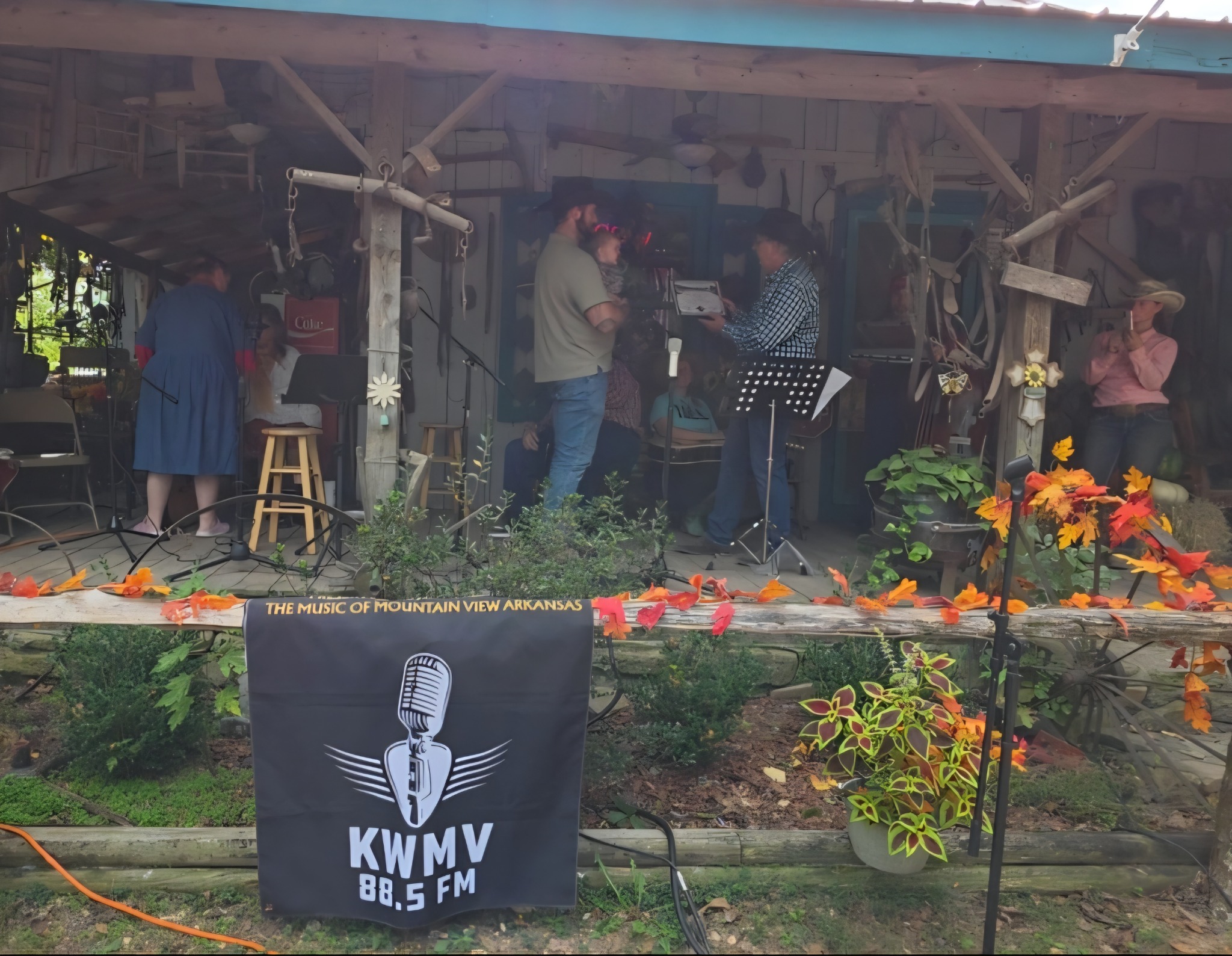 Musicians gather to play on the OK Trading Post porch.