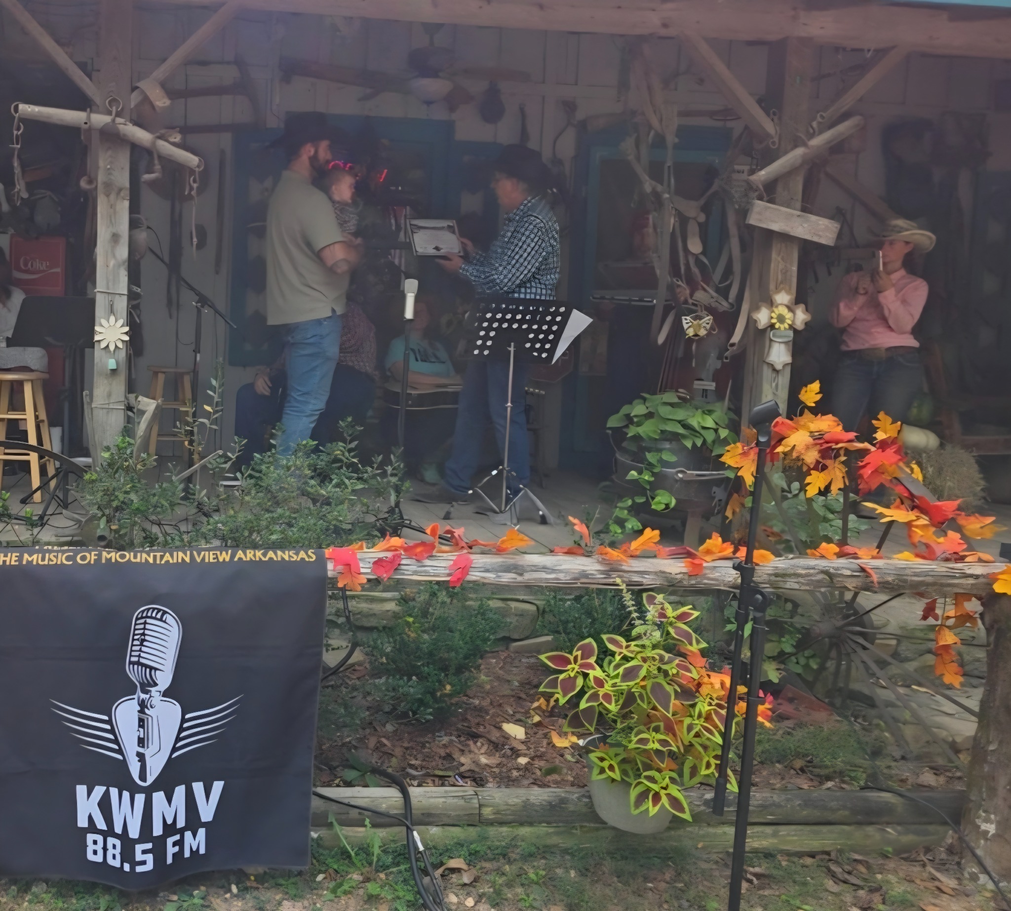Derek accepts the medallion and Certificate of Remembrance on behalf of the cowboys, honoring Samuel “Sam” Speaks at the O.K. Trading Post Front Porch Jam. Approximately 2:45 p.m. · October 10, 2026 · Photograph by Becky Thomas Timberlane.