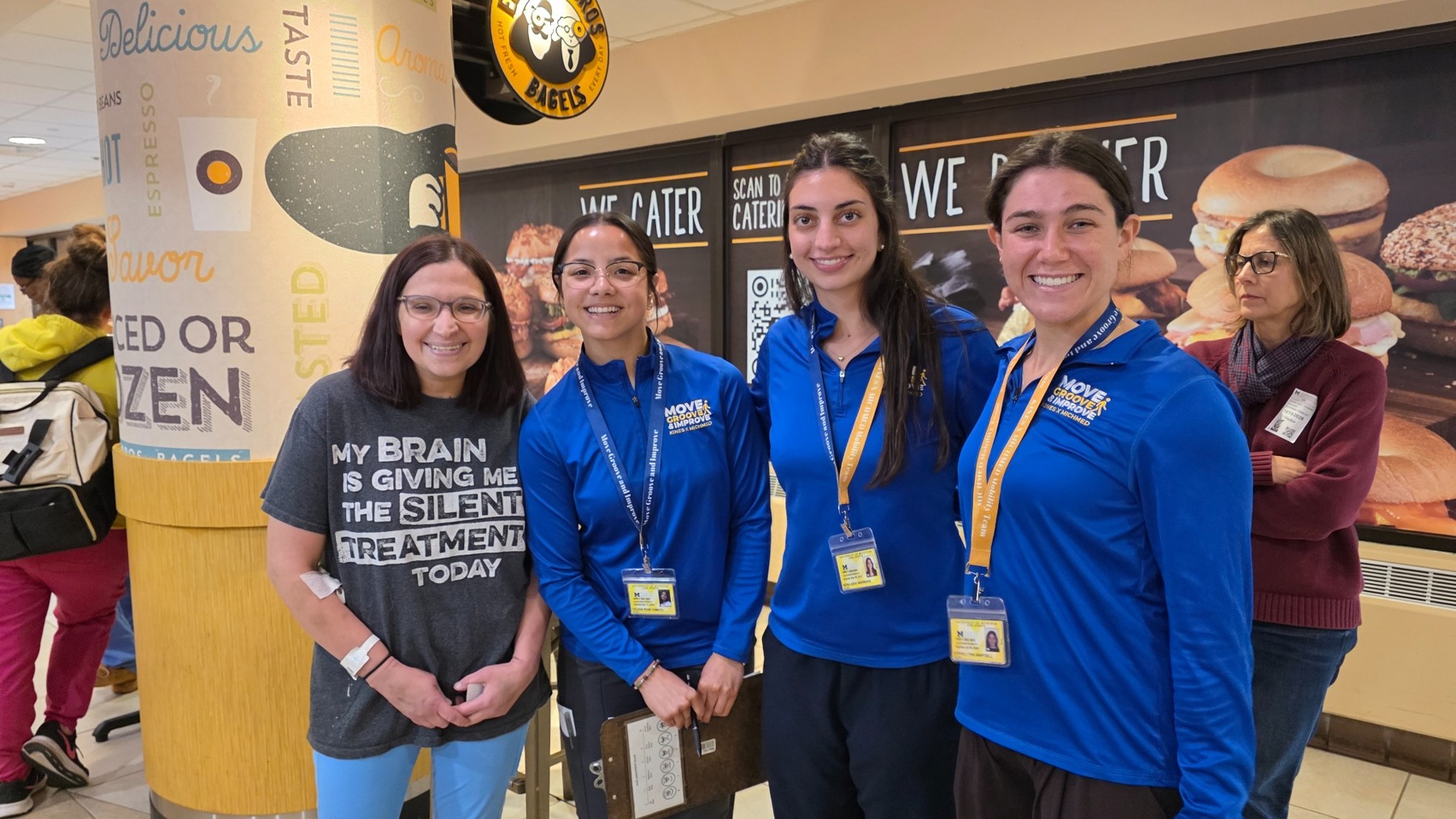 Lori with three young women pursuing paths in research and therapy at U of M. A few minutes together gave us hope.